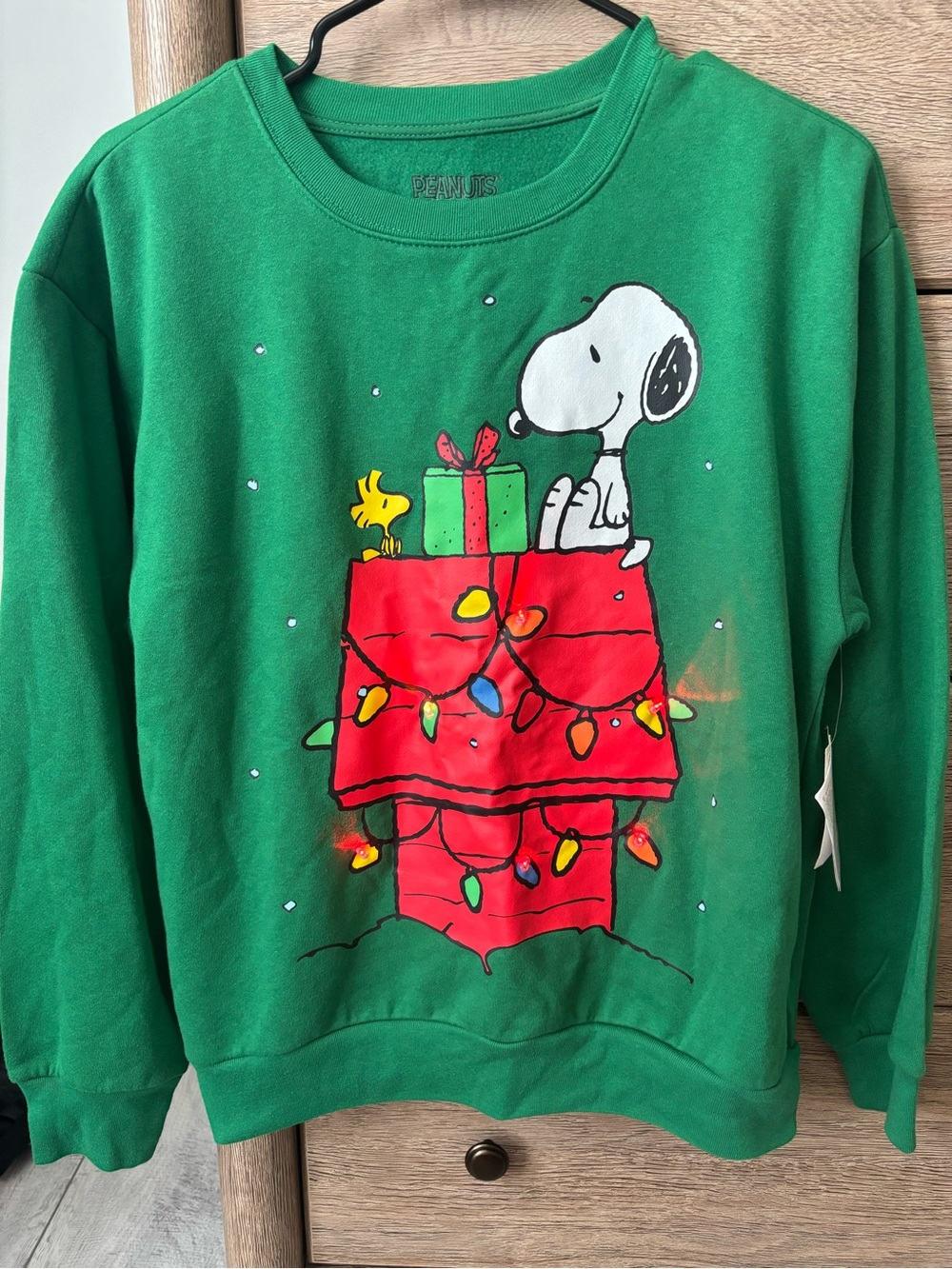 Peanuts light up Green Crewneck with Snoopy label
